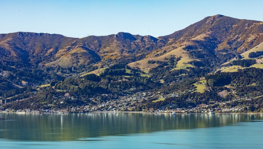 View across still harbour waters